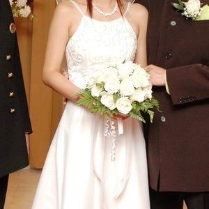 Used wedding dress with minor damages at the bottom